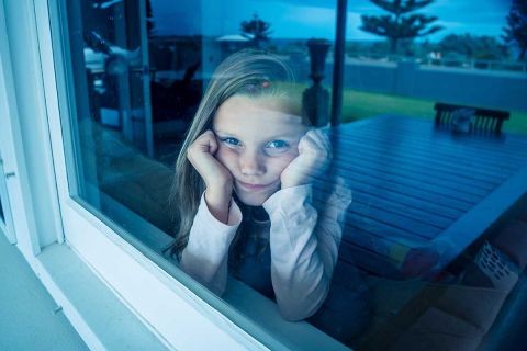 girl looking out window