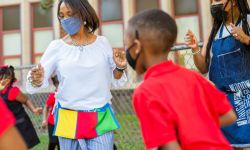 Educators and students celebrate the first day of school at Paul Robeson Malcom X Academy in Detroit.