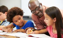 teacher working with students