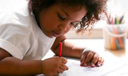 young girl coloring