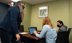 people around a desk 