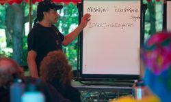 Man stands in front of white board