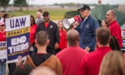 President Joe Biden speaks into a bullhorn