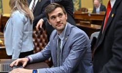  Rep. Josh Schriver sitting at a table