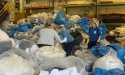 a bunch of trash bags in a warehouse