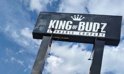 A black sign for King of Budz cannabis store