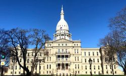 The outside of the Michigan capitol building on a sunny day