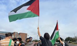 People holding Palestine flags