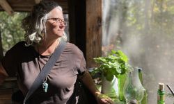 Kathleen Heideman standing next to a window