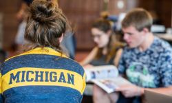 College students. One of the students is wearing a University of Michigan shirt