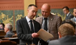 Two men stand in Michigan House chambers