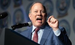 Detroit Mayor Mike Duggan speaking into a microphone 