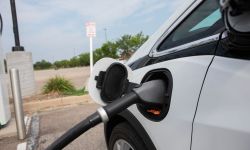 A white Chevy Bolt being charged 