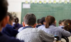 Kids sit in classroom