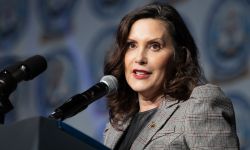 Gov. Gretchen Whitmer speaks into a microphone. 