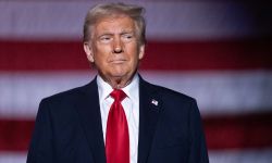 President Donald Trump wears navy suit and red tie. 