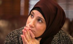 Mariam Charara watches the inauguration at her home in Dearborn